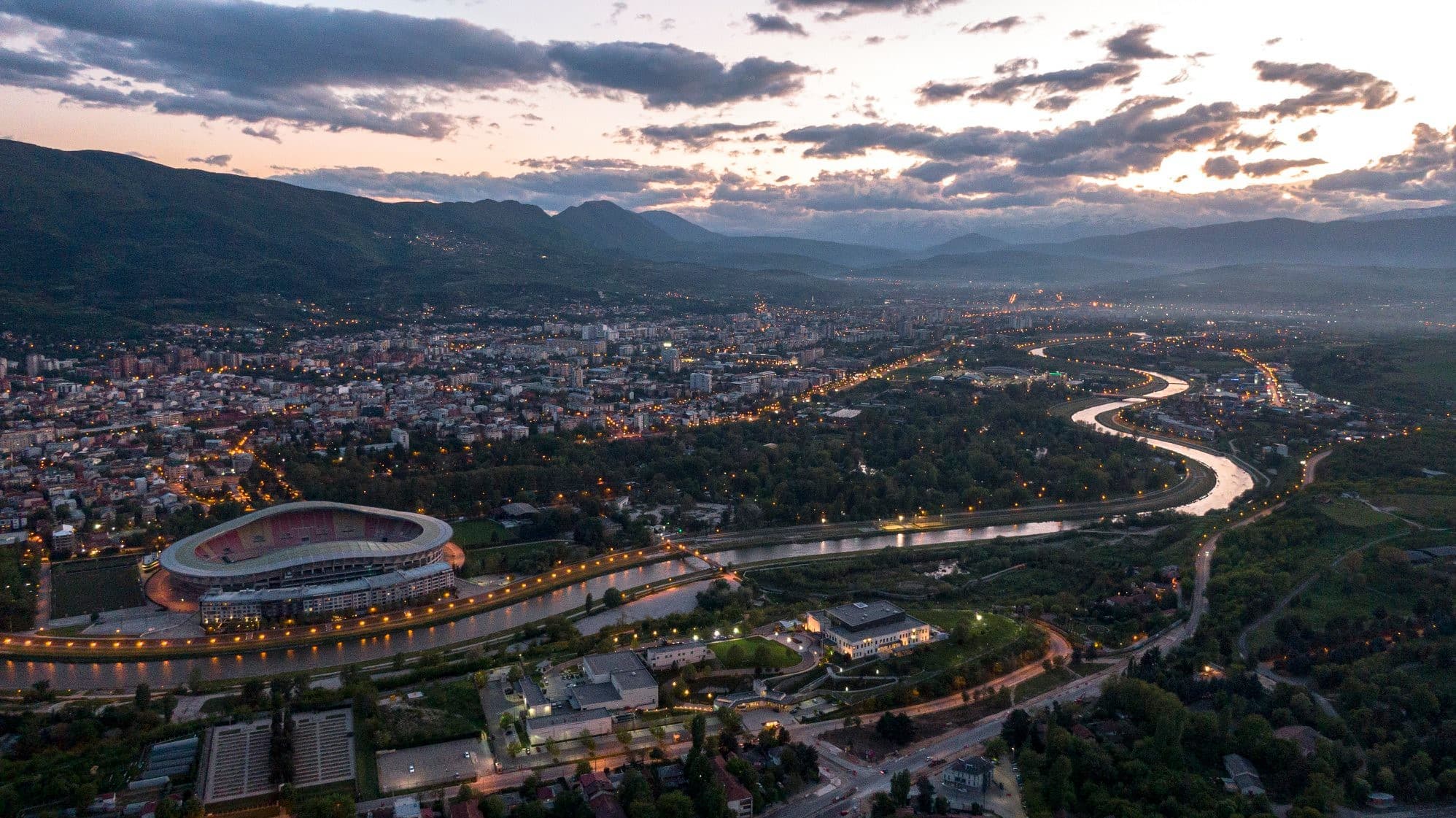 Aerial view of Skopje at dusk with city lights
